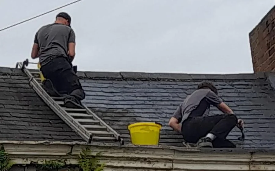 A genuine D.J.K Roofcare job — our team working on a pitched roof